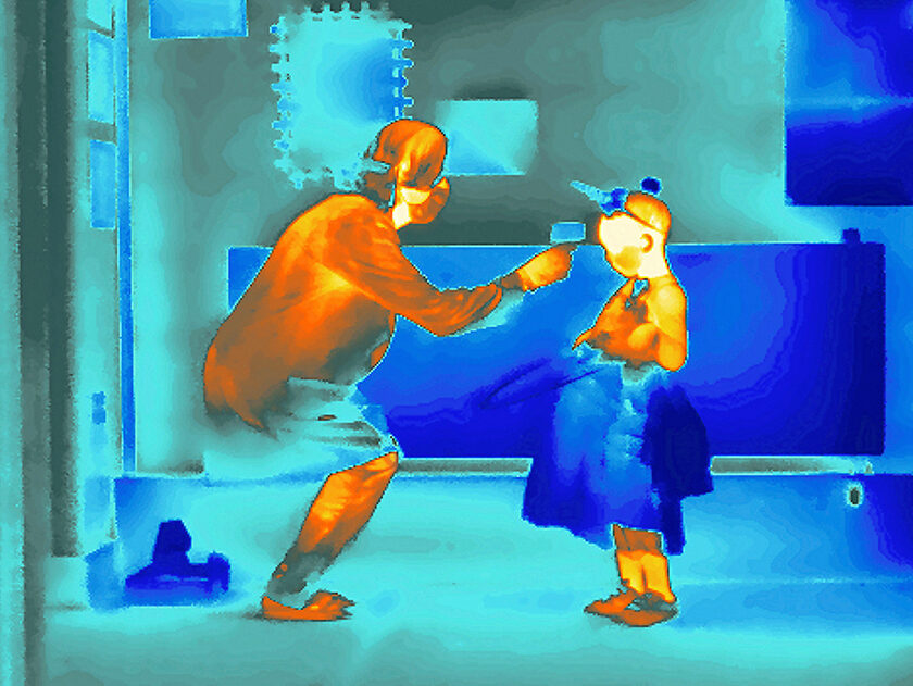 London - 30th June 2020: We find ourselves unexpectedly living in an age when body temperature has assumed a new set of implications: we’re all potential carriers and spreaders of Covid-19. As part of a conceptual series of images shot on assignment, I used a thermal camera to examine what daily life currently looks like with restrictions placed on ordinary events and new routines becoming our everyday. Here, a pupil at L’Ecole de Battersea - an English-French bilingual preparatory school in South London - has their temperature checked by a member of staff as they enter the school. Since reopening at the start of June the school has been seeking solutions to lower the risk of transmission between staff and pupils and have implemented a range of measures, including installation of IQ air purifiers with HEPA filters, which remove PM2.5 particles containing bacteria and viruses. Fogging machines, which use Hypochlorous acid to decontaminate the school, are also used throughout the building. This has resulted in no reported cases of COVID-19 at the school during the pandemic so far.